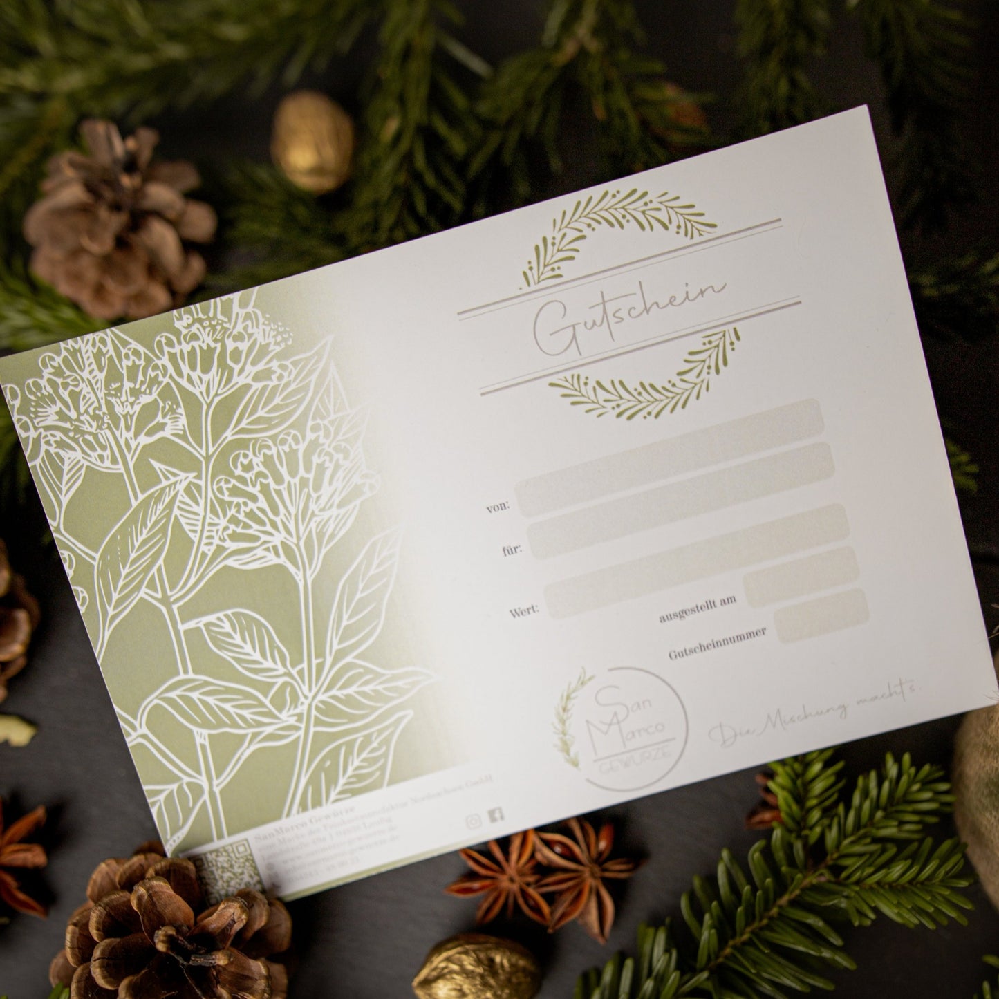 Gutschein von Sanmarco auf Tannenzweigen